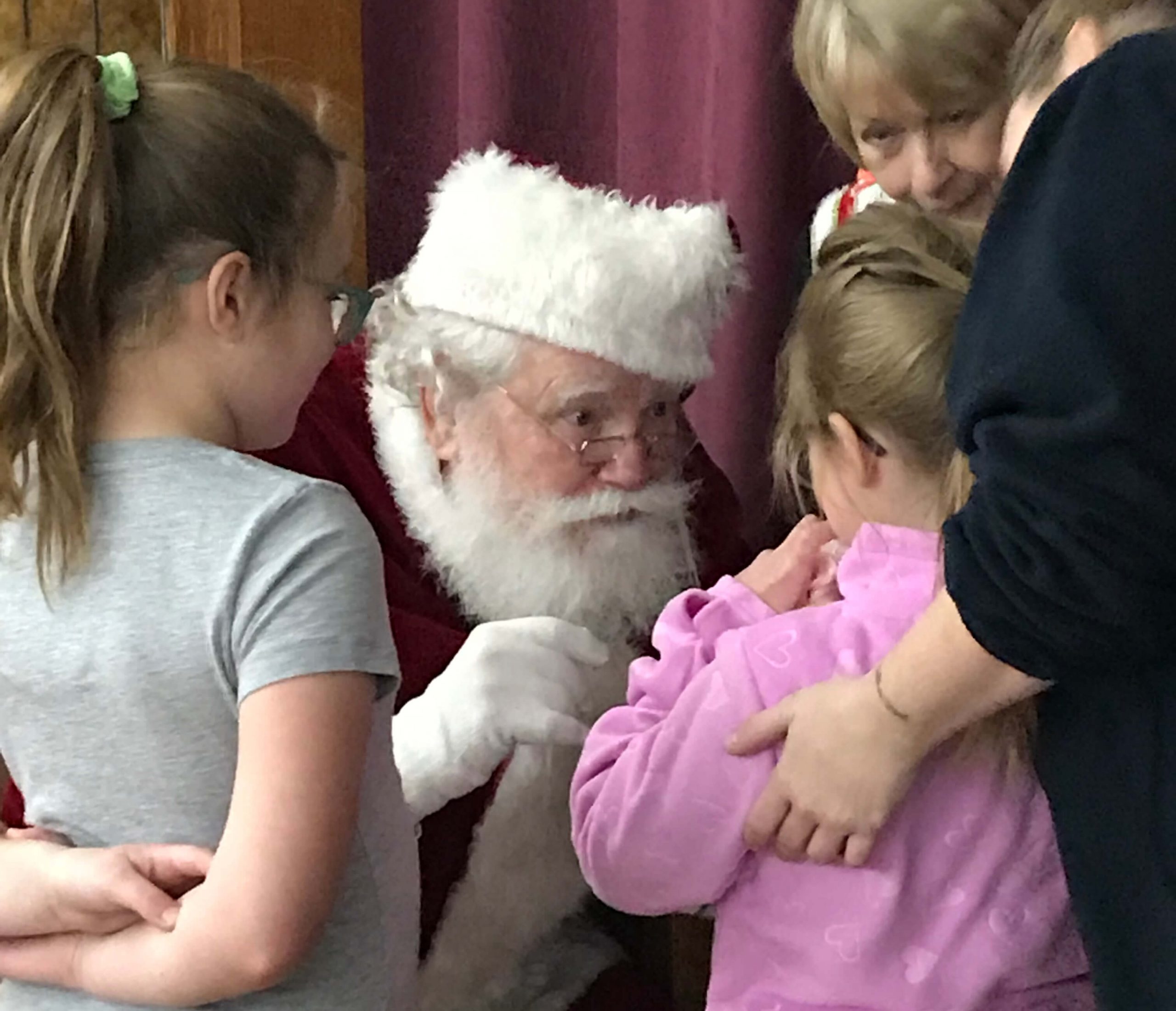 Santa at clothe a child